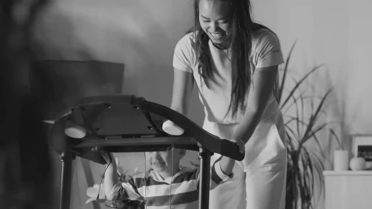 Woman with child on treadmill