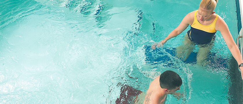 Aquatic Therapy: Therapist in Pool with Patient