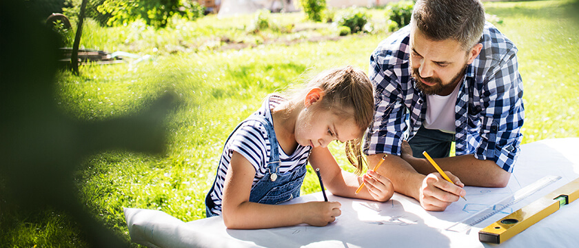 Dad and Daughter Drawing Outside
