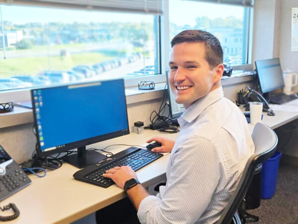 Dr. Samuel Davidson in Clinic at a Computer
