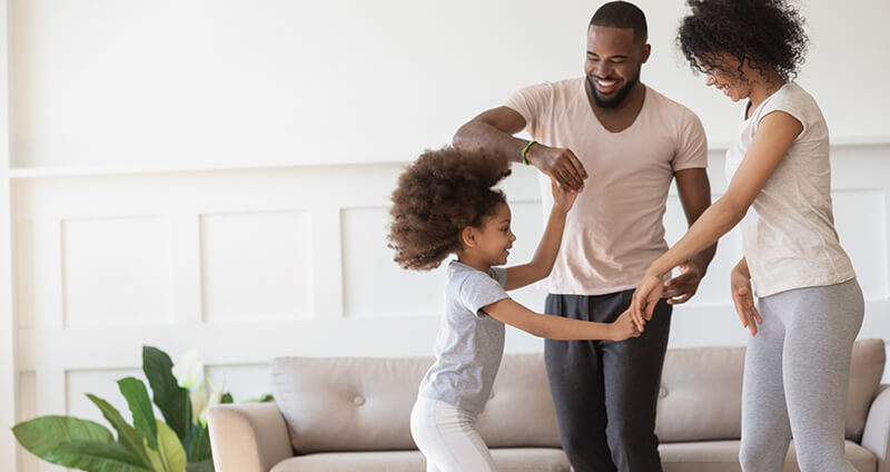 Family Dancing in Living Room
