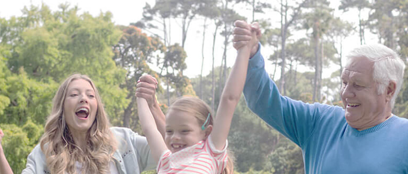 Mother and Her Dad Lifting a Girl, Outdoors