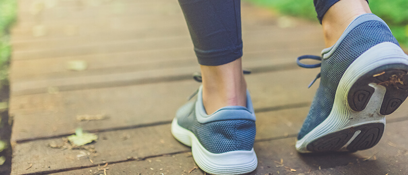 Close Up of Female Feet Walking in Athletic Shoes