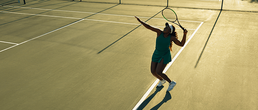 Female Tennis Player Ready to Hit Ball