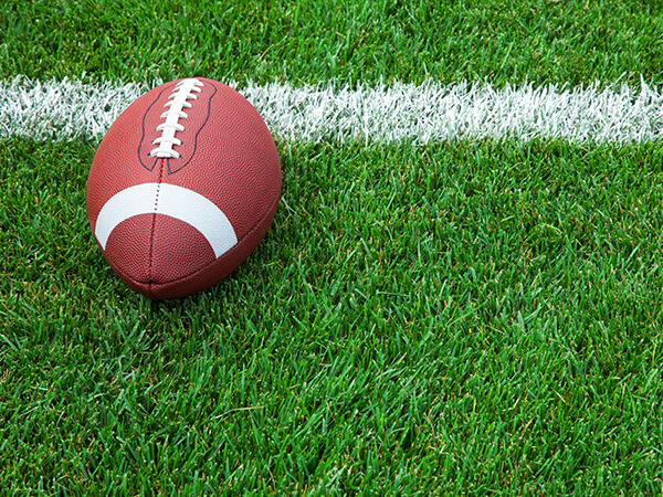 Football and Line on Grass / Turf