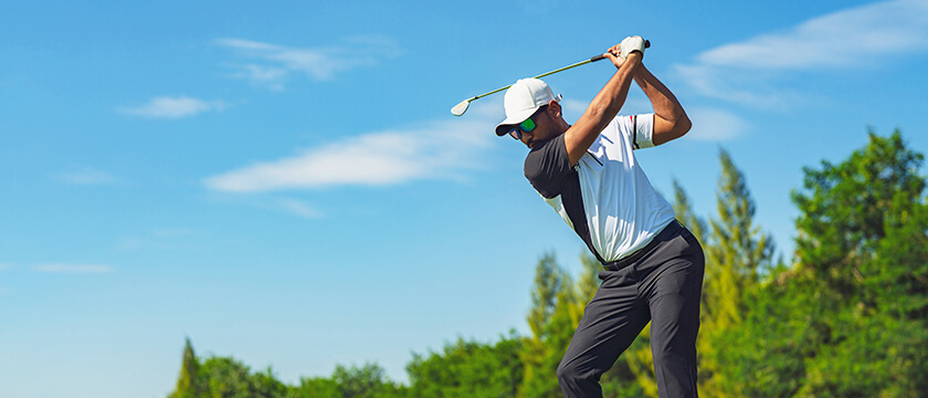 Golfer Swinging