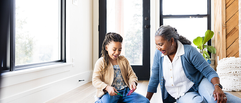 Grandmother and Granddaughter Playing on the Floor, Inside