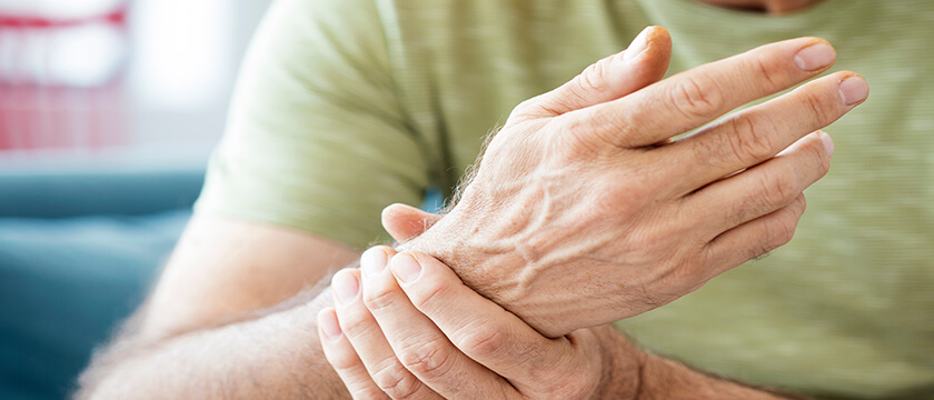 Close Up of Man Grasping Wrist