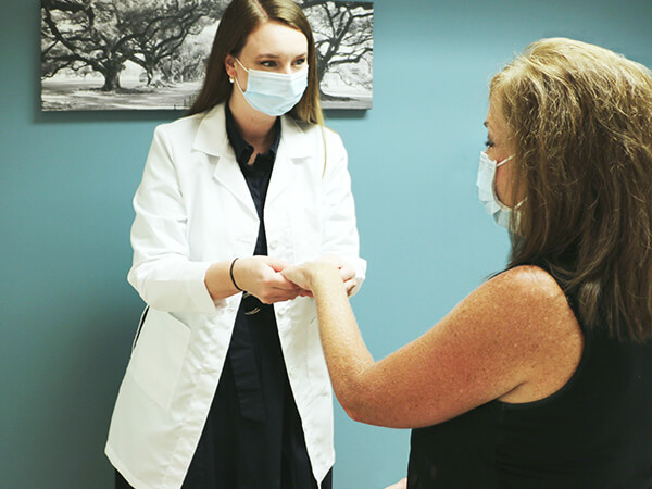 Dr. Kelsey Holkesvik Examines Patient