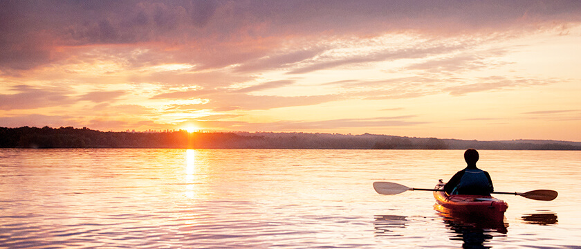Person in Canoe on Lake