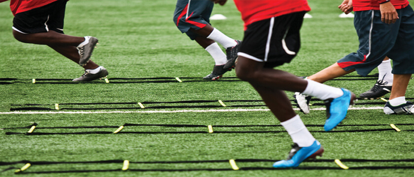 Athlete Running a Ladder Drill with Toe Pointed