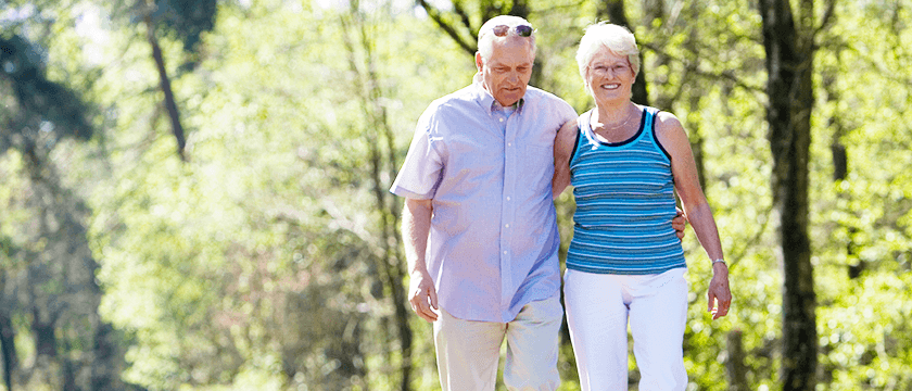 Older Couple Walking Outside Together