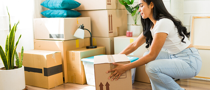 Woman Packing Boxes