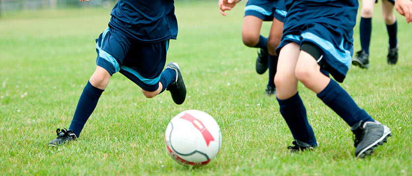 A Soccer Game with Feet and Ball