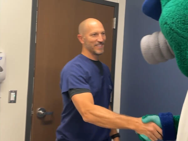 Dr. Scott Reynolds Greeting Stormy for an Elbow Problem