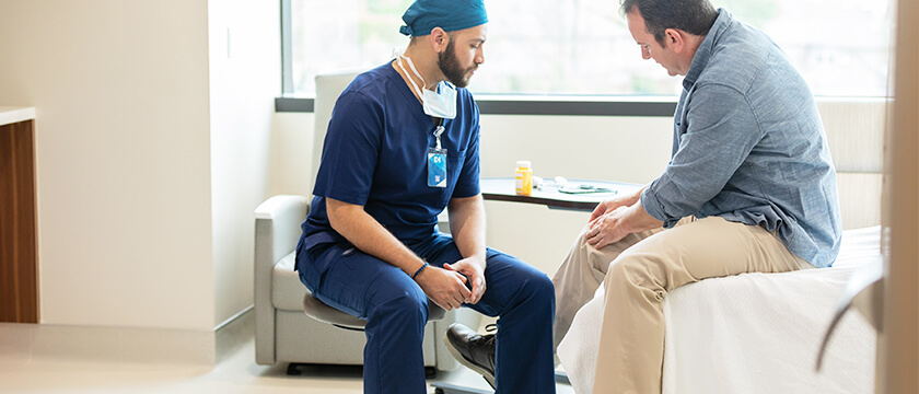 Doctor Looking at Man's Leg