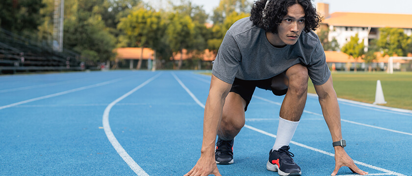 Focused Track Runner in a Starting Stance