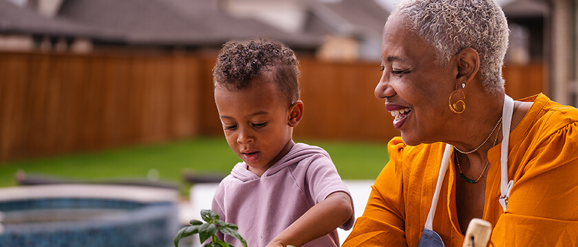 Older Woman Gardening with a Grandchild
