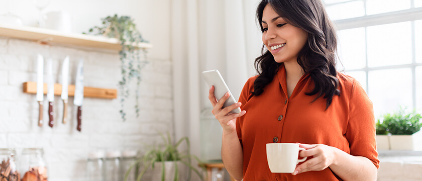 Woman on Her Phone with Coffee