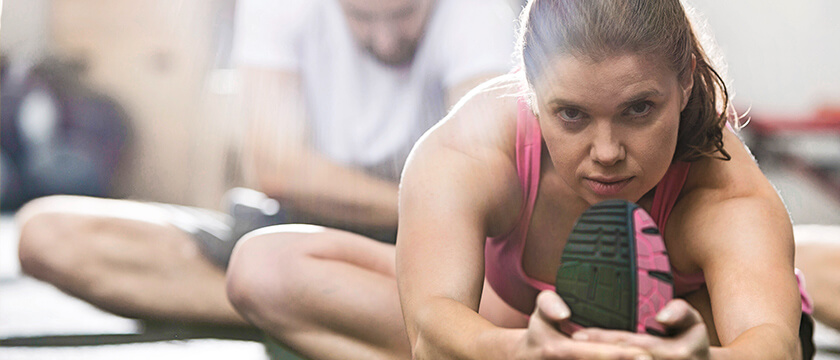 Woman Stretching with Determined Look